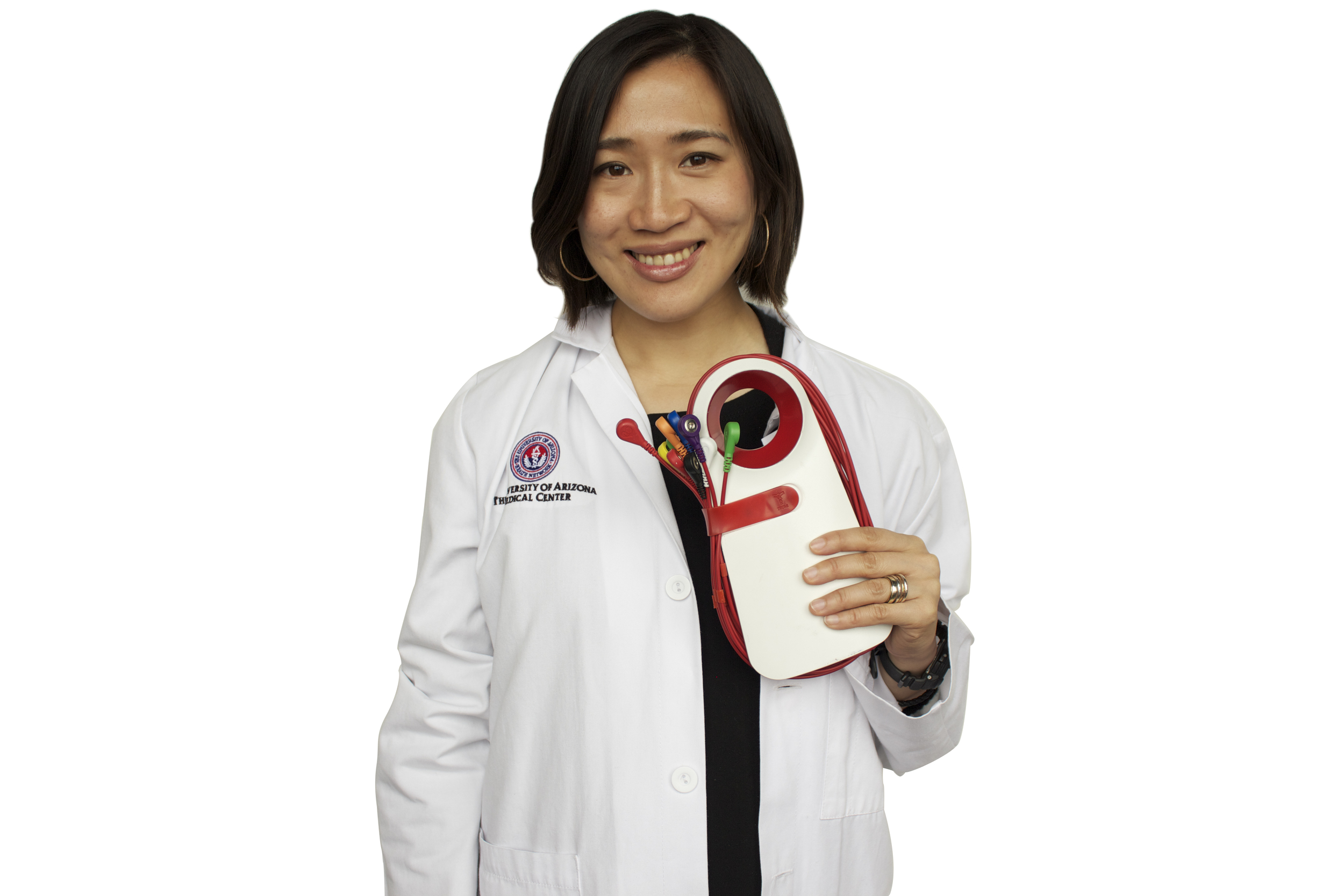 Clinician holding the Triomi EKG device